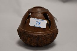 A 20th century carved Brazil nut shell with nuts inside.