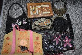 Four early 20th century ladies hand bags having hand sewn and embroidered bird images, and two