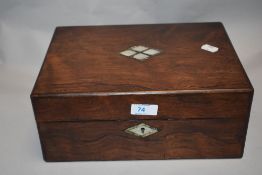A Victorian sewing case having Rose wood case with a well fitted interior and mother of pearl