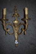 A modern heavy cast brass twin branch light fitting with a classical design.