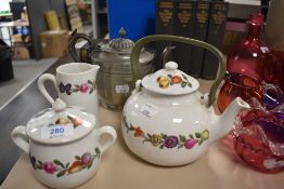 A Porcelain De Paris part tea set with a silver plated tea pot.
