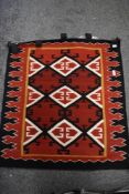 Two vintage North Navaho American Native style wall hangings with a geometric design. 79cm x 80cm