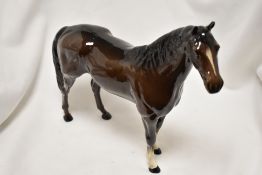 A Beswick animal study of a Thoroughbred stallion.