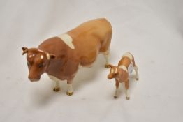 A Beswick Guernsey bull Sir Richmond 14th. 1451 with Cow 1248 and Calf 1249A having restoration to