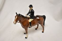 A Beswick figure study Huntswoman On Brown Horse Style 2 HN 1730