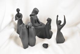 Four Royal Doulton black Basalt figure studies including Awakening, Mother and Daughter, Other two