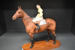 A Beswick Connoisseur model Arkle and Pat Taffe Up 2084 marked as second with replacement reigns.