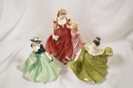 Two Royal Doulton figurine studies including Pretty Ladies and Lynne witha Royal Worcester Holly.