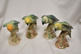 Four Beswick animal studies of Parakeets no. 930, one being overpainted and one being AF.