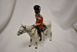 A Beswick figure study of the Duke of Edinburgh on Almein HN1588.