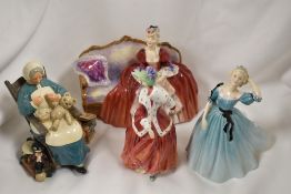 Four Royal Doulton figurine studies including Christmas Morn, Nanny, Celeste and Bell O The Ball.