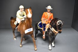 A Beswick Canadian Mountie 1375 and Jockey on Walking Race Horse 1037 both having damage to ear.