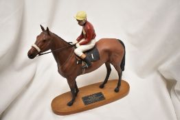 A Beswick Connoisseur model Red Rum Brian Fletcher UP2511 Reigns have been replaced.