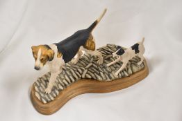 A Border Fine Arts animal study of a Terrier dog and a Fox Hound.