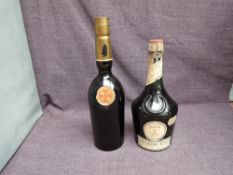 A bottle of Benedictine D.O.M, 43% no capacity stated and a bottle of Sandeman's Sherry no