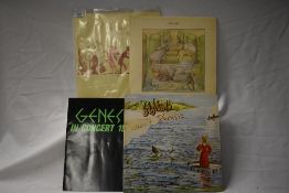 A lot of three Genesis albums on the Charisma Mad Hatter Label and a 1980 concert programme.
