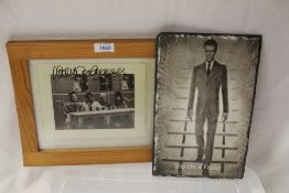 A lot of framed David Bowie pictures with a printed slate piece in this lot