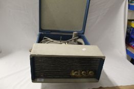 A portable record player by Perio - does need some TLC but has a great vintage 1960's look to it -