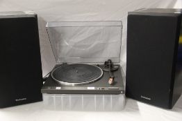 A pair of technics speakers SB3410 with a technics turntable SL B210