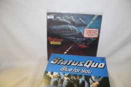 A lot of two albums - a rare early Kraftwerk collection and a not so rare album by Status Quo