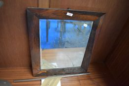 An antique Rose wood framed bevel edged mirror.