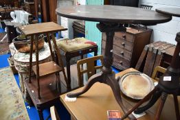 An 18th century tilt top tea table with gallery support on tripod base with turned column.