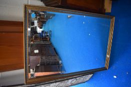 A modern gilt framed hall mirror.