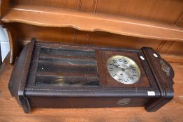 An early 20th Century mahogany cased wall clock