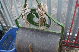 A large Victorian garden roller and similar.