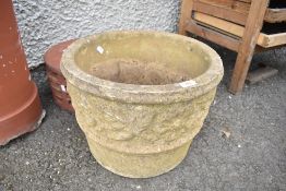 A composite stone cast garden planter.