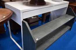 A modern with laminate desk with two drawers.