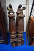 A set of four Victorian carved oak table legs with pot castors.