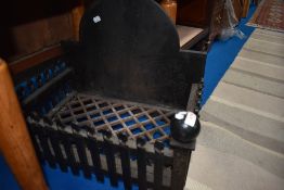 A vintage cast iron fire grate for inglenook.