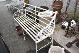 A Victorian wrought iron garden bench.