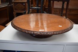 An early 20th century golden oak lazy Susan.
