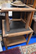 Two mid century slate effect topped side tables.