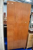An Art Deco single wardrobe with an oak case.