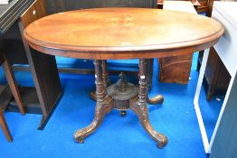 An early Victorian inlayed loo table with four column support possibly Irish.