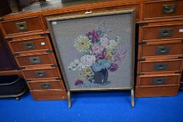 An early 20th century fire screen.