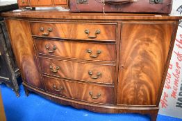 An early 20th century bow fronted side board / chest of drawers
