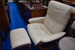 A Stressless cream leather chair and foot stool.