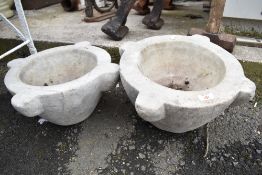 A pair of marble carved bowls or planters.
