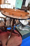 A Victorian wine table having tripod base.