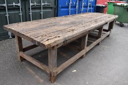 An antique wood workers three bay Bench with plank top. 12ft by 4ft