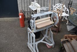 A vintage metal framed washing mangle.