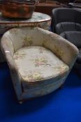 An early 20th century salon style tub chair.