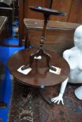 An early 20th Century mahogany wine table and a reproduction Regency coffee table