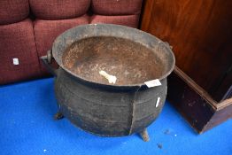 An antique cast iron travellers cauldron.
