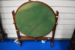 An early 20th century fold away card table.