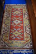A vintage Turkish style rug, 1.3m long approx.